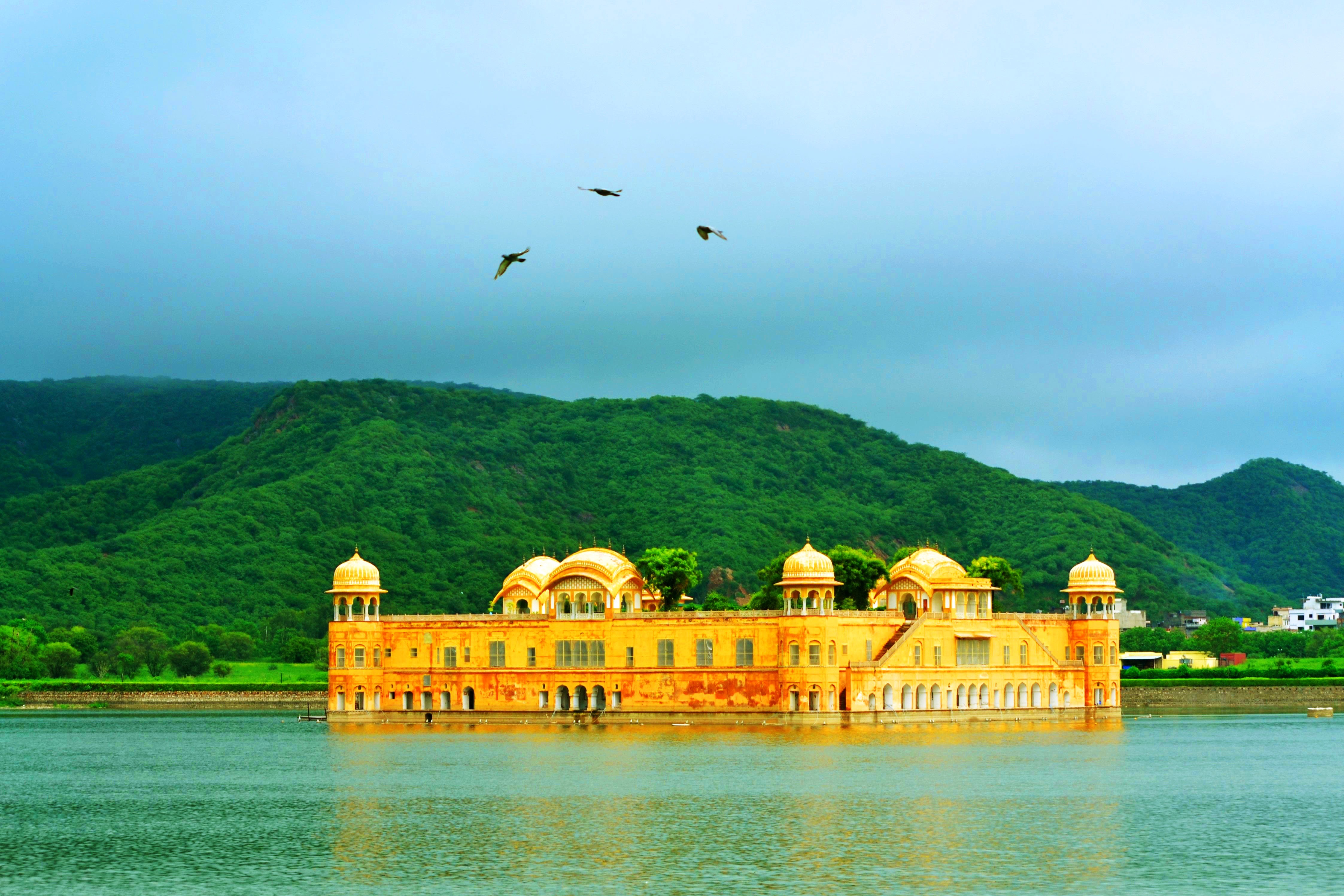 The Jal Mahal with birds flying atop, Jaipur, India