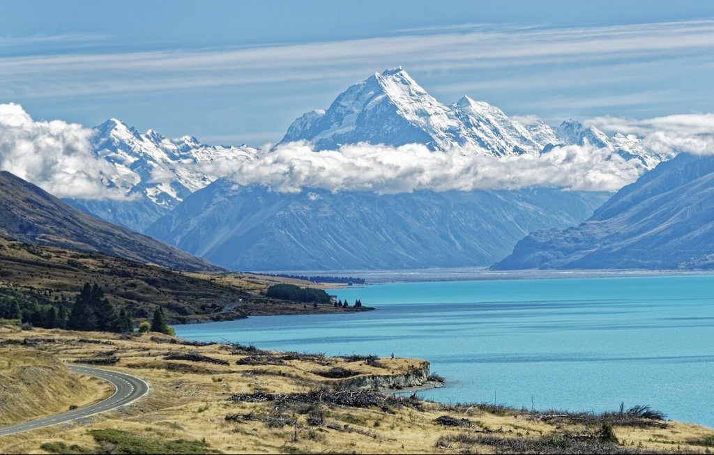 visit mt. cook aoraki through the drive by beautiful blue lake pukaki-top things to do in new zealand