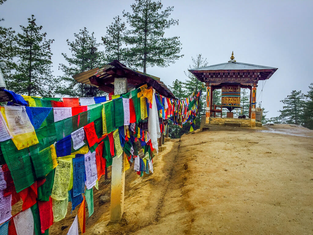 Flags and Prayer Wheel a the midpoint of the Tiger's Nest Trek