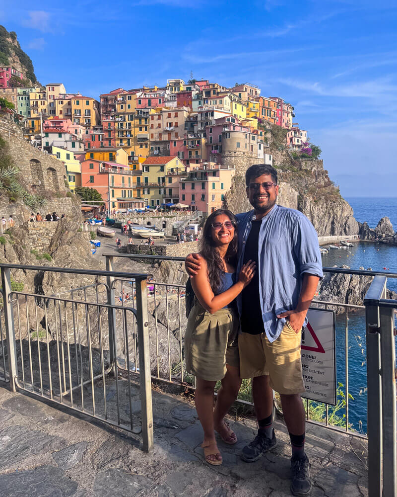 Us posing with the stunning view of Manarola in the background