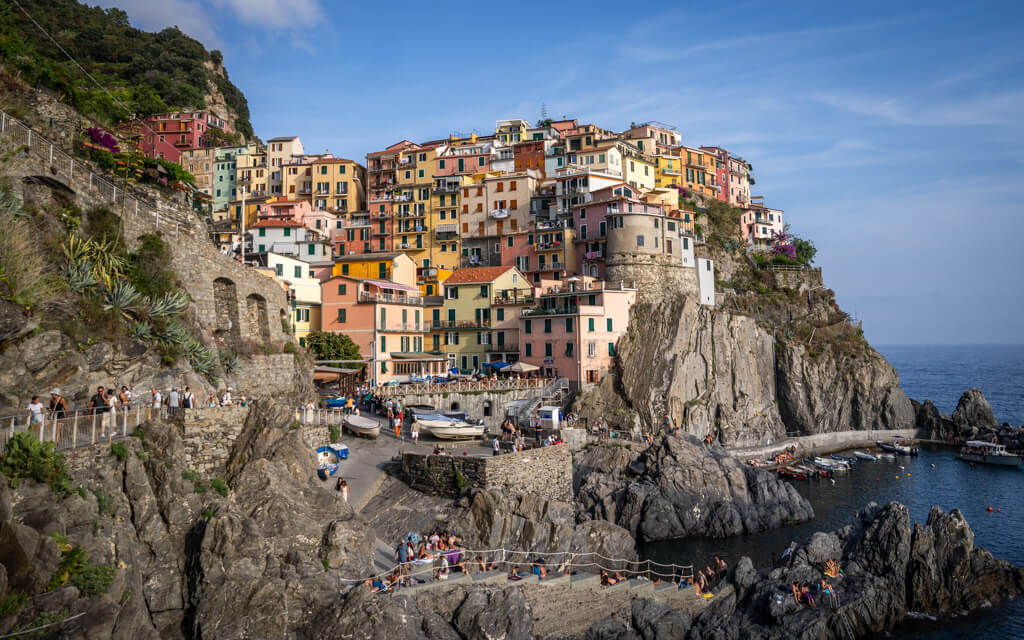 The stunning Manarola in Cinque Terre -a fishing village with colourful houses built atop a cliff