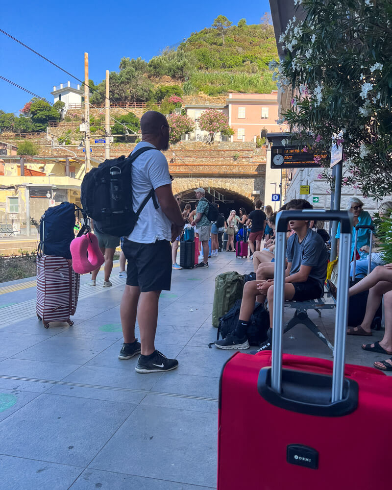 Train station with people waiting for the train in Riomaggiore