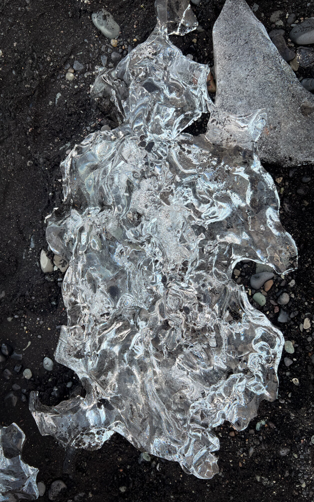 10-Day Iceland Itinerary: An Unforgettable Road Trip 39 A pice of ice lying on the diamond beach in Iceland