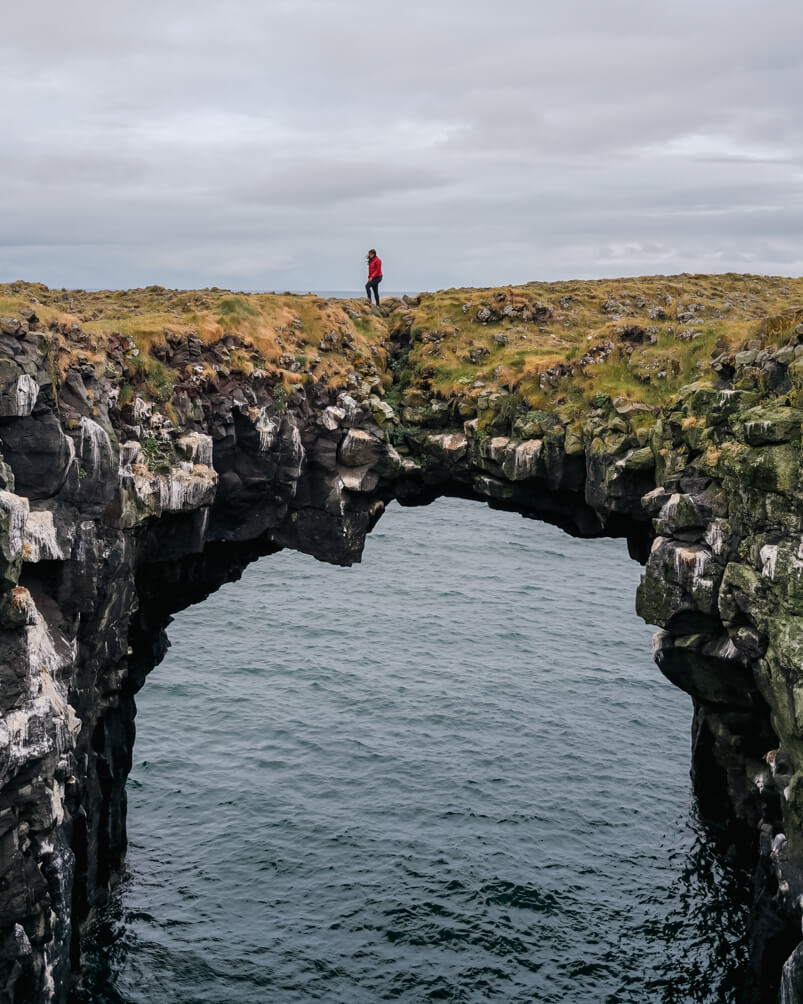 10-Day Iceland Itinerary: An Unforgettable Road Trip 60 Walking over the Arnastapi Stone Bridge in Iceland