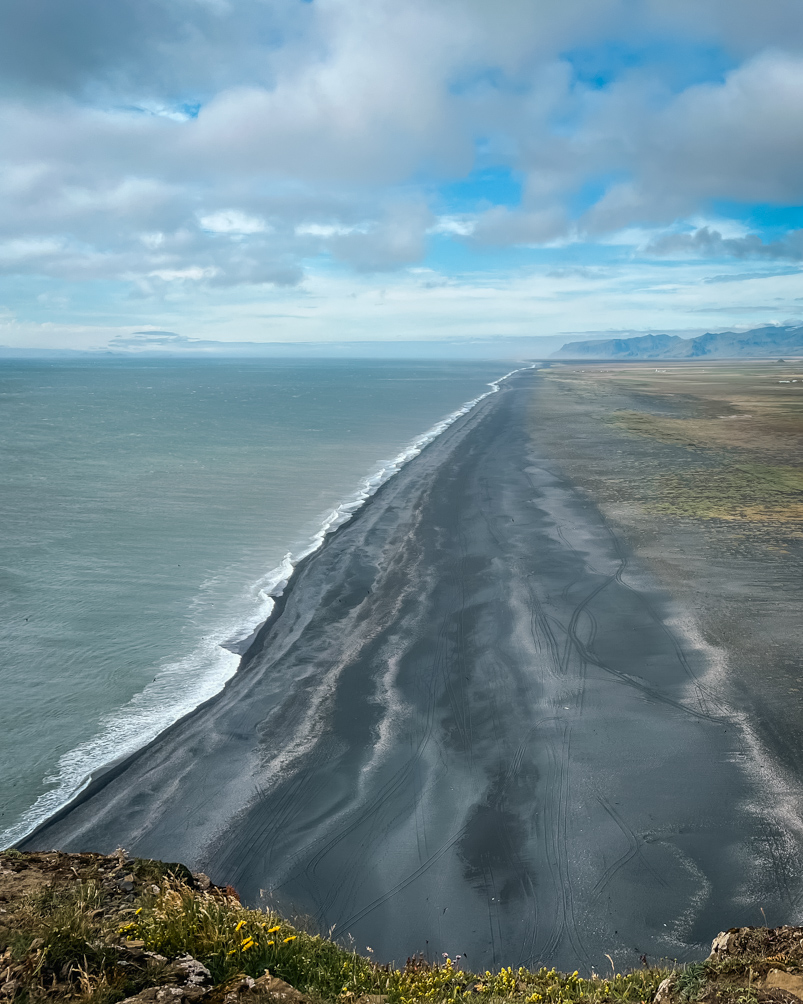 10-Day Iceland Itinerary: An Unforgettable Road Trip 27 Expansive view of a black beach from Dryholaey