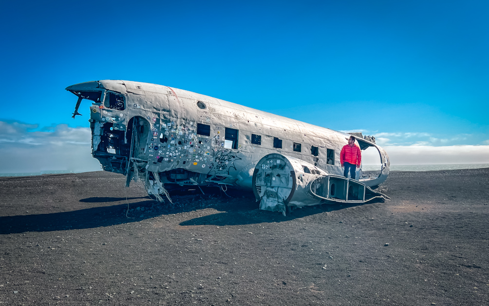 10-Day Iceland Itinerary: An Unforgettable Road Trip 25 A man standing on the Solheimasandur Plane Wreck