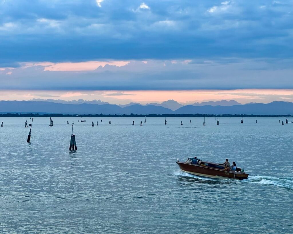 What to See in Venice in 2 Days: The Ultimate Itinerary 17 Dolomites in the distance as seen from the pier in Venice