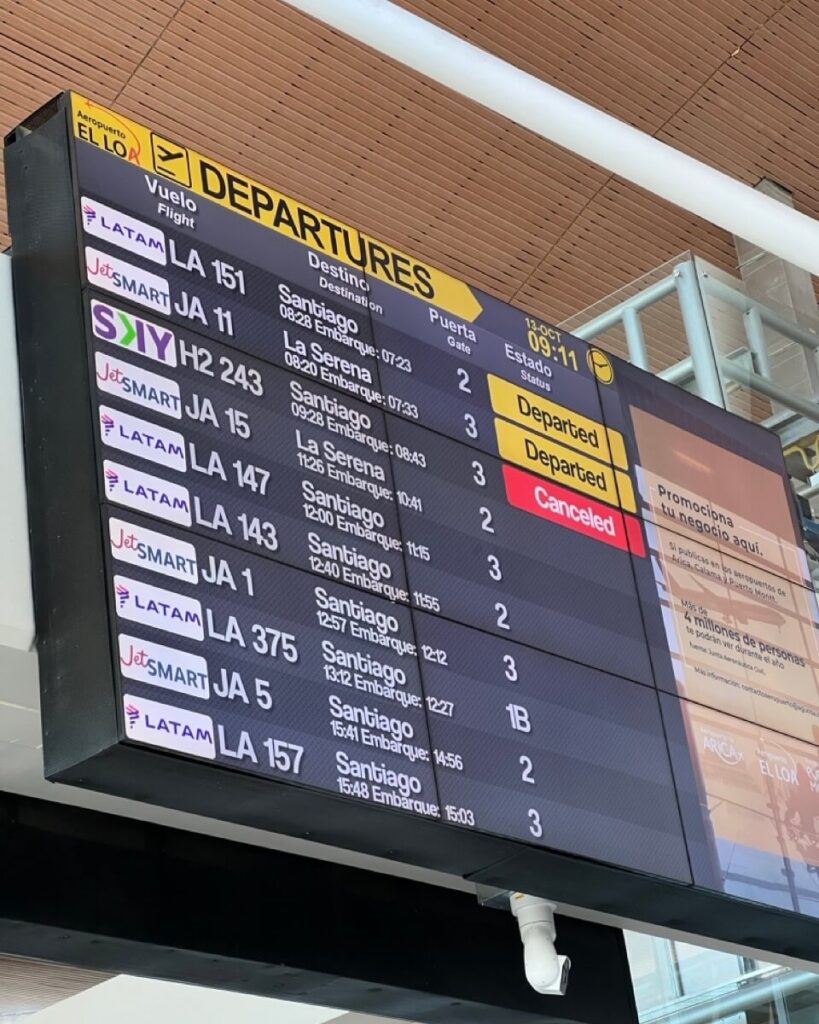 A board at the airport showing that our flight is cancelled