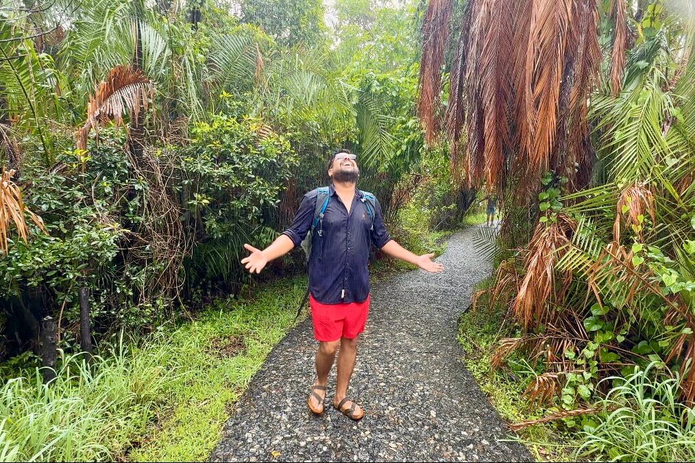 The Perfect 3 Days Victoria Falls Itinerary and Guide 10 A man enjoying getting drenched in the spray from Victoria Falls