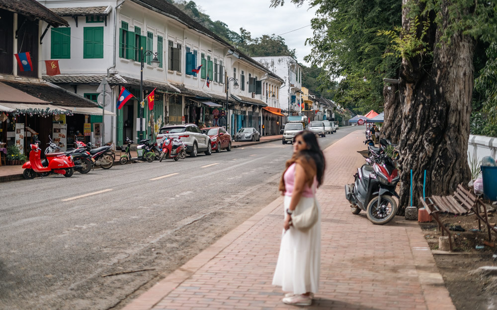 The Only Laos Itinerary You Need for 1 Week in Laos 16 A girl walking on the streets of Luang Prabang