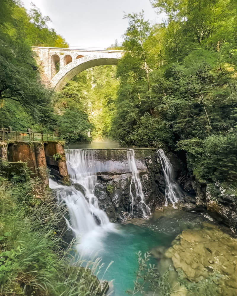 2-Day Lake Bled Itinerary: The Perfect Road Trip Guide 16 The waterfall with an aquaduct on top at Vingtar Gorge