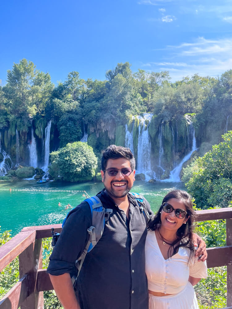 Day Trip to Mostar from Split or Dubrovnik (How to Plan It) 3 A couple posing infront of Kravice Falls